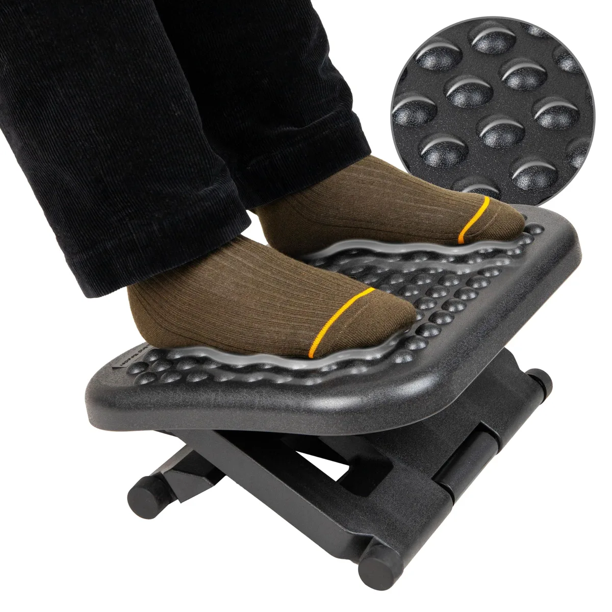 Black plastic footrest with leather textured surface 17 by 13 inches adjustable height