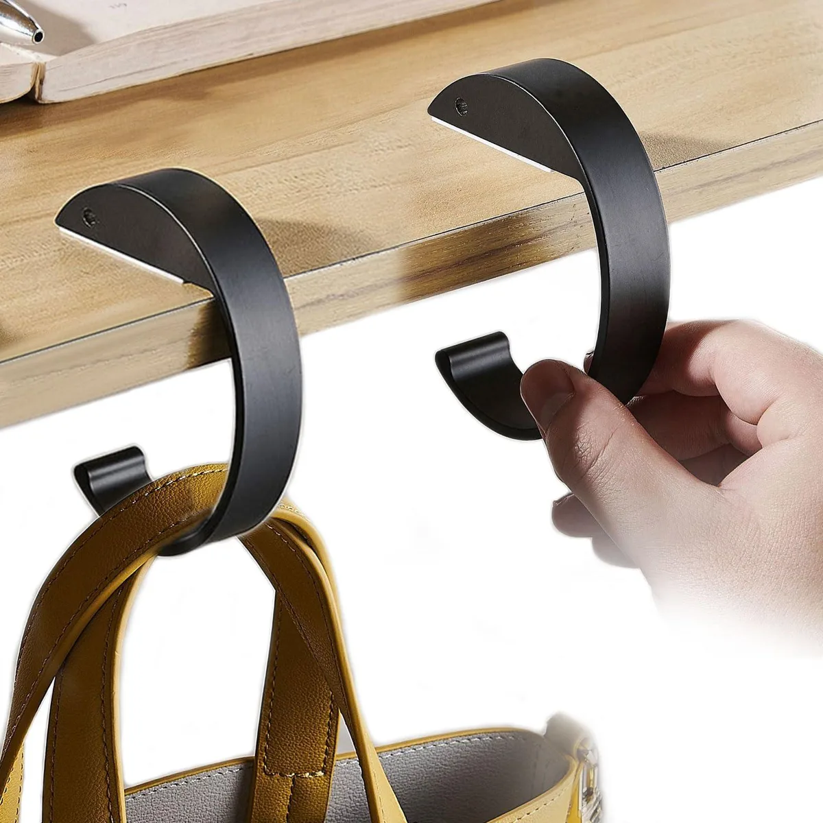 Two black C-shaped purse hooks, alloy finish, 2.75 by 3.78 inches each