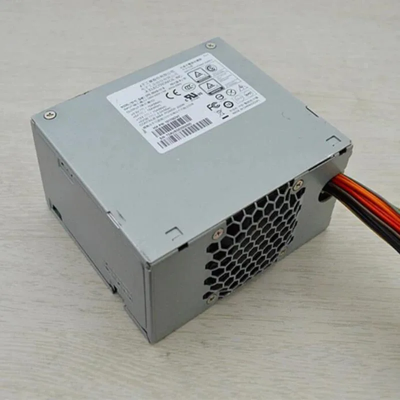 Rectangular metal power supply unit with 20-pin connector and multiple IDE plugs