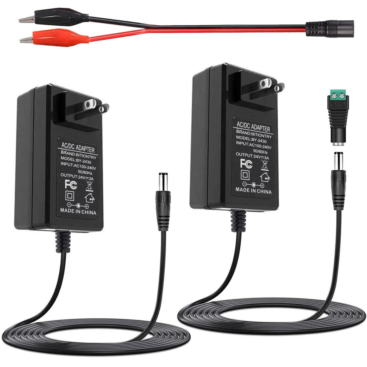 Two black rectangular AC adapters with 5.5mm barrel connectors and a female DC plug