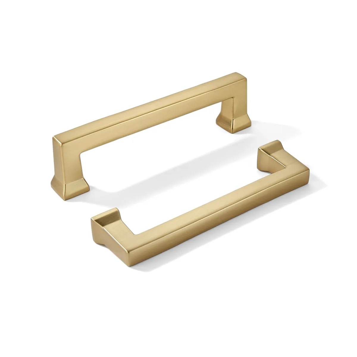 Two champagne bronze cabinet pulls, bar style, 82 mm hole centres, warm brass finish