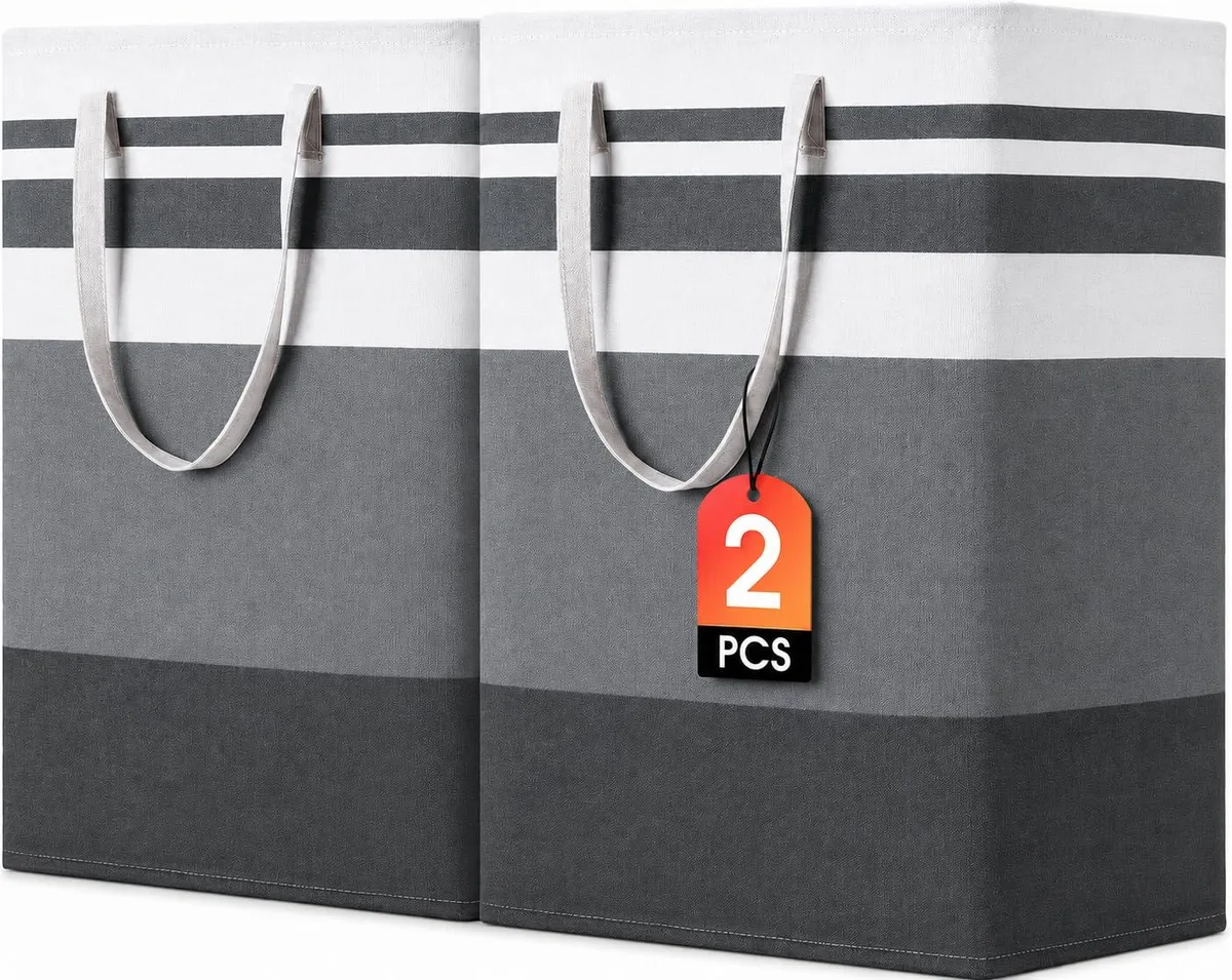 Two grey fabric laundry baskets with wire frames standing upright, reinforced handles visible, collapsible design shown folded flat
