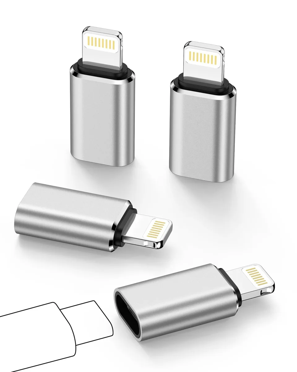 Four small black and white USB-C to Lightning adapters on a plain surface