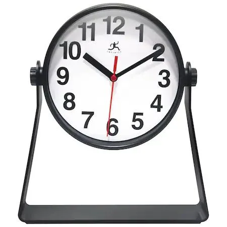 Black stirrup desktop clock with round face and curved stand