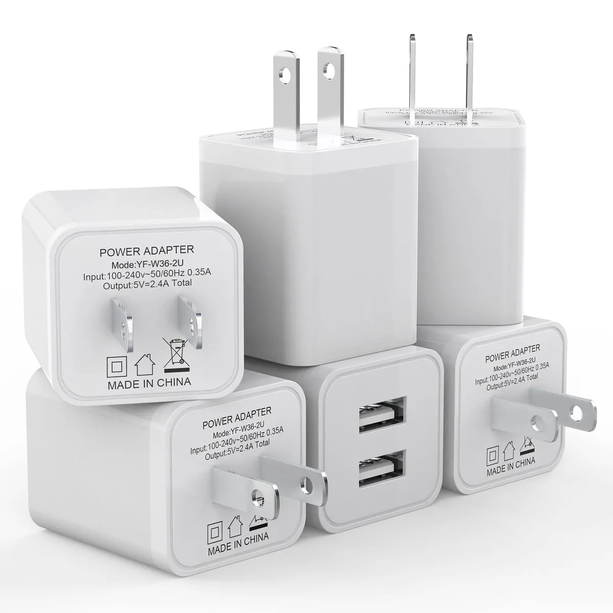 Six white cube chargers each with two USB ports