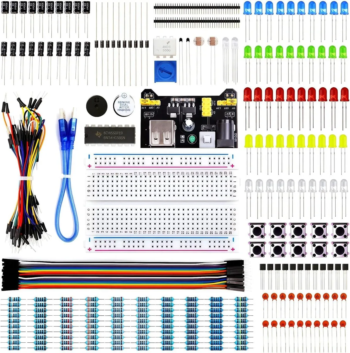 Open component kit box showing breadboard, power module, jumper wires, resistors, LEDs and labeled parts