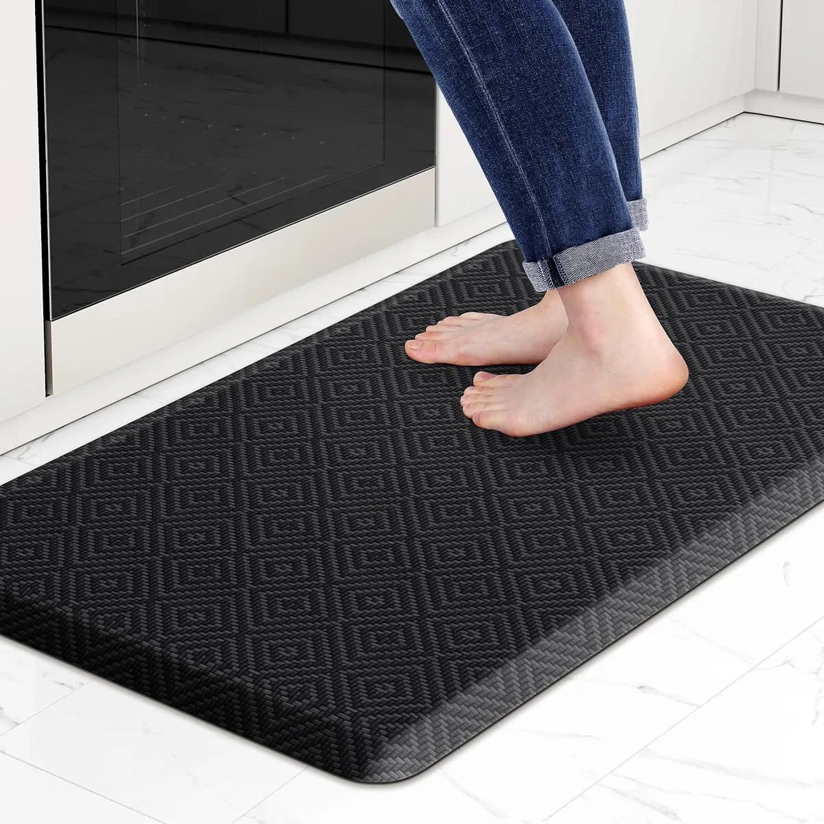 Rectangular black runner mat with beveled edges .5 inch thick 28 by 17.3 inches