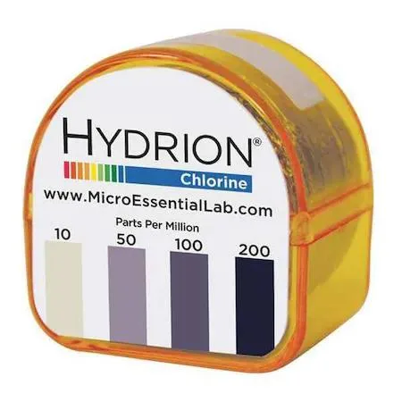 White test paper refill roll with pink glow color chart in PVC dispenser