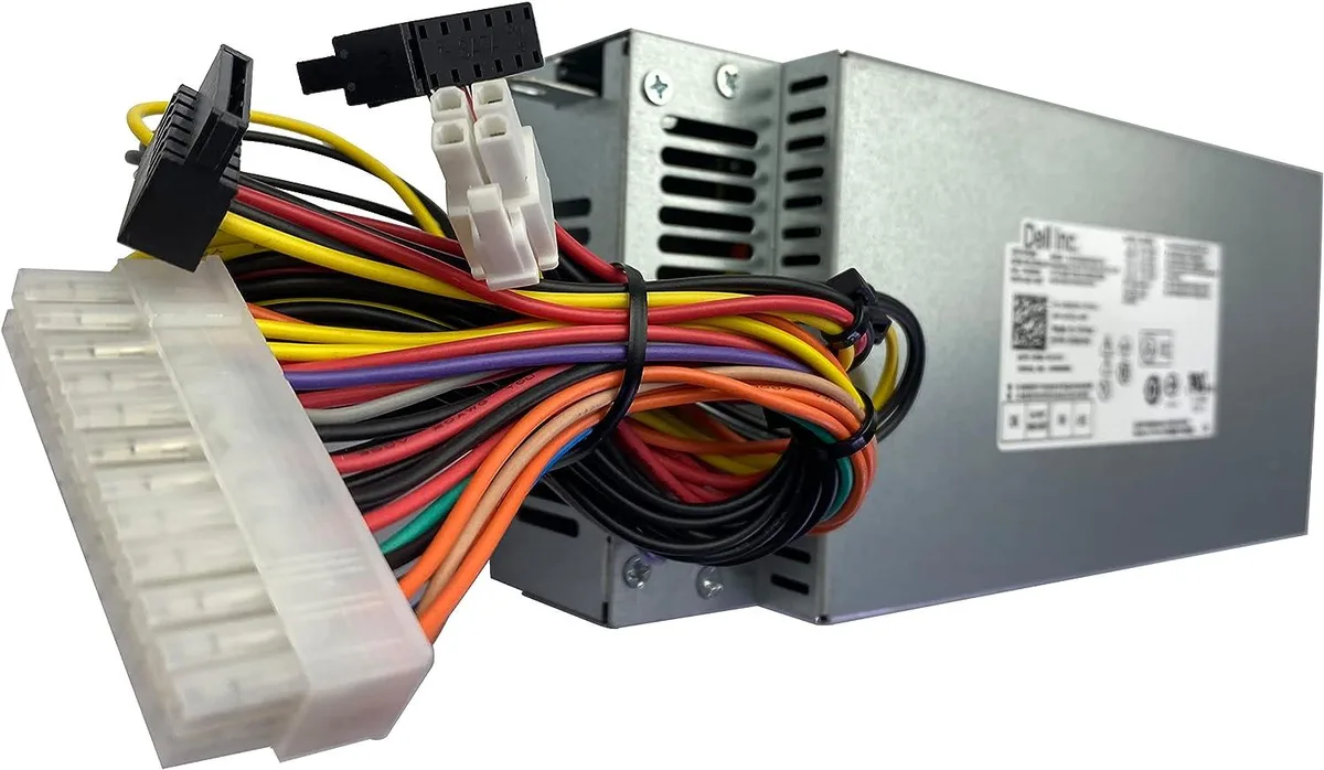 Rectangular black metal power supply unit with ventilation grille and rear power socket