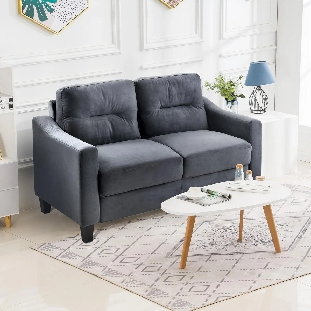 Black velvet sectional sofa with straight arms and plush cushions