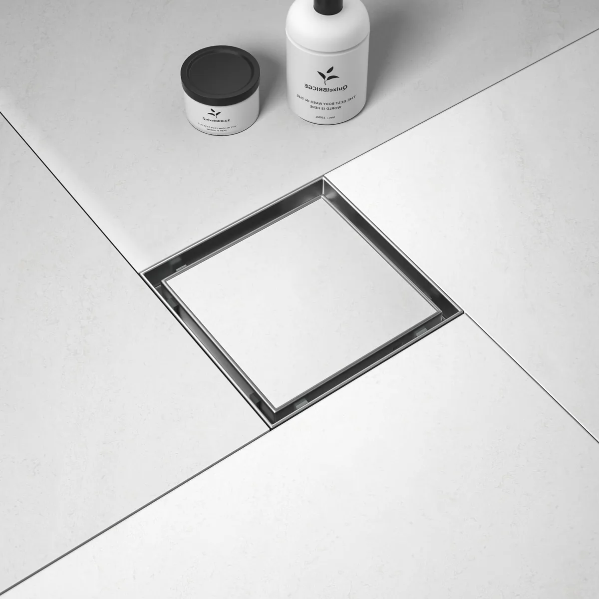 Square stainless steel shower drain with brushed finish and tile insert grate