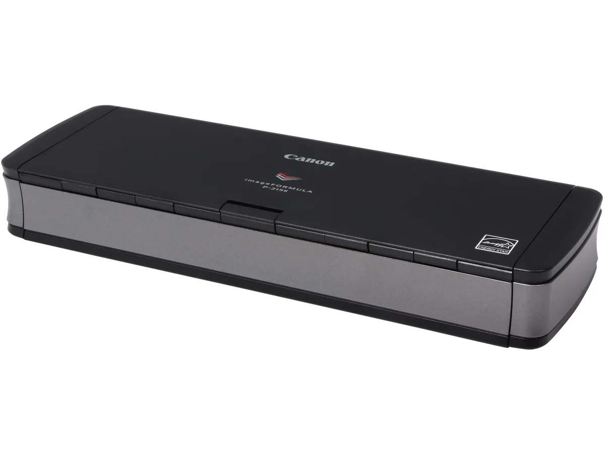 Compact sheet-fed scanner in matte black and grey, trays closed, USB cable attached