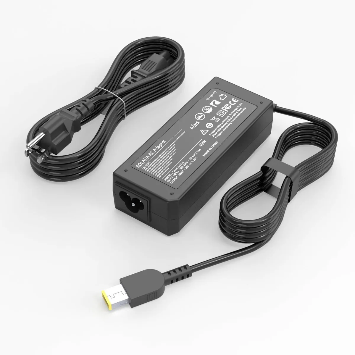 Black rectangular power brick with yellow square USB tip and coiled cable