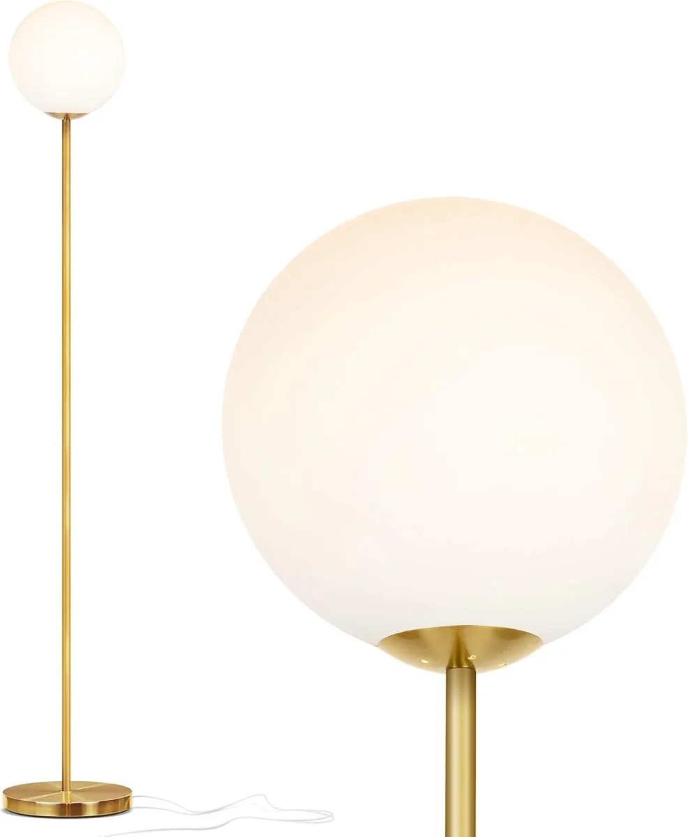 Tall brass gold floor lamp with frosted glass globe shade and heavy base