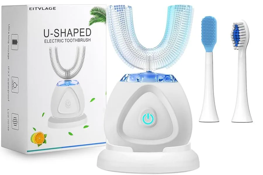 White U-shaped ultrasonic toothbrush with silicone brush head and wireless charging dock