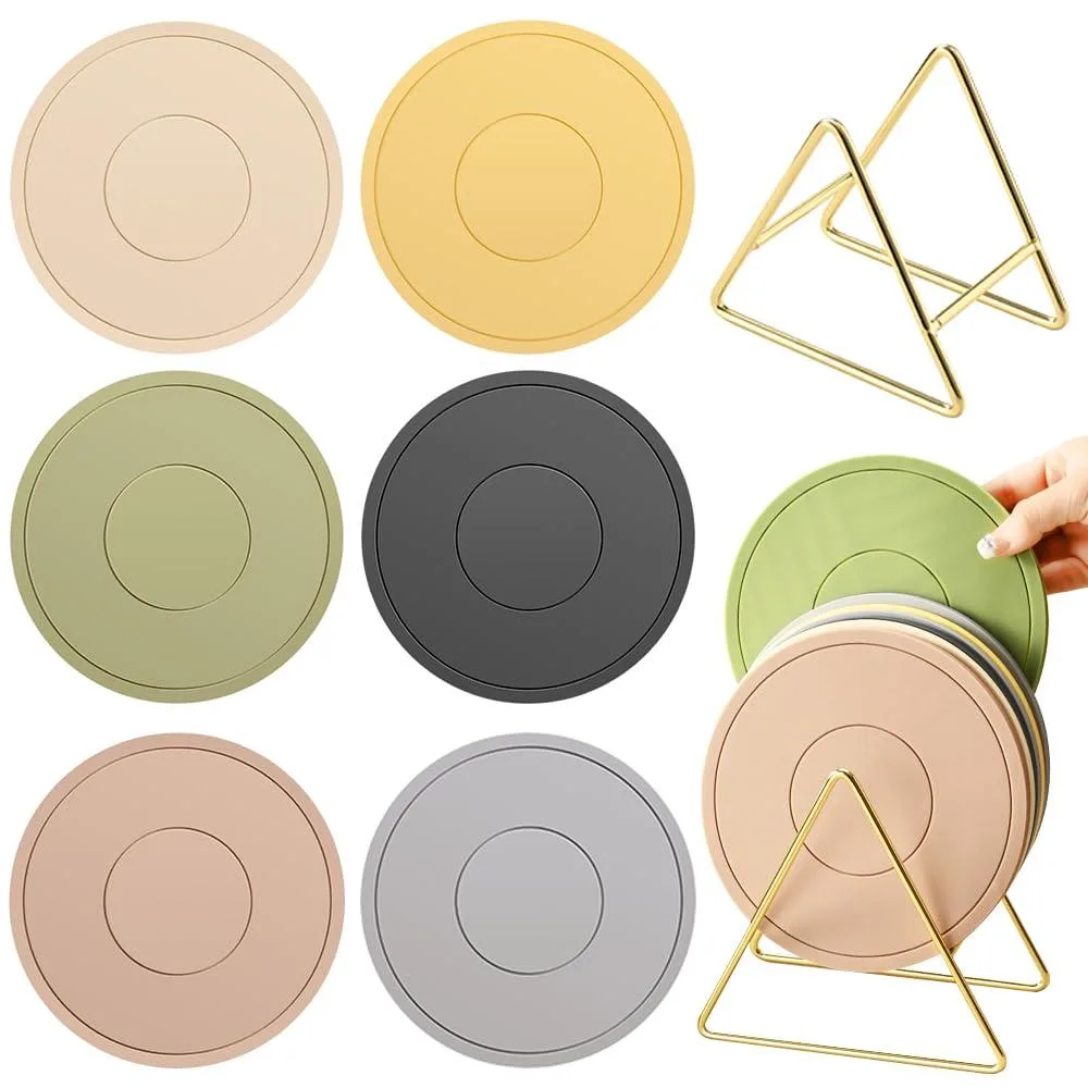 Six coloured silicone pot holders and a gold triangle rack