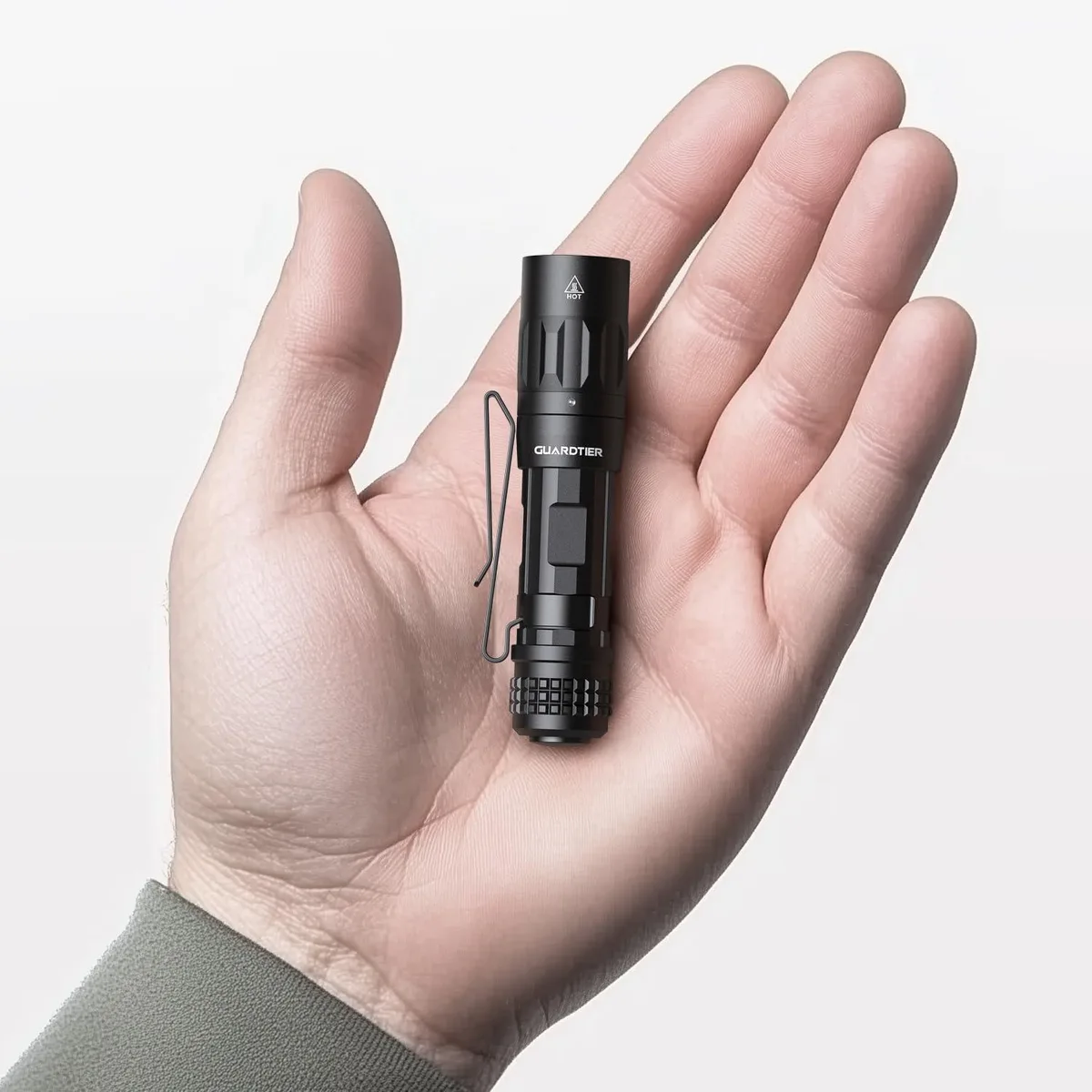 Black cylindrical flashlight with pocket clip, matte anodised finish, USB-C port visible