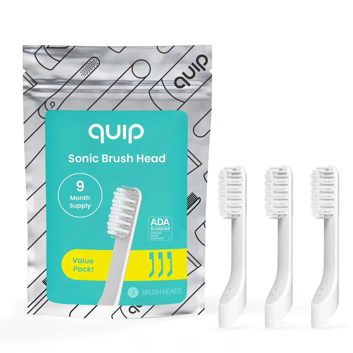 Three white brush heads with soft bristles and tongue scrapers on back