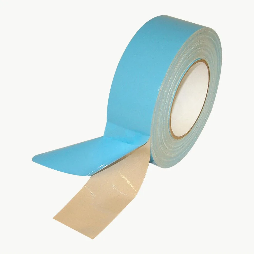 Beige double-sided carpet tape roll on 3-inch core, cloth backing, rubber adhesive, LDPE liner