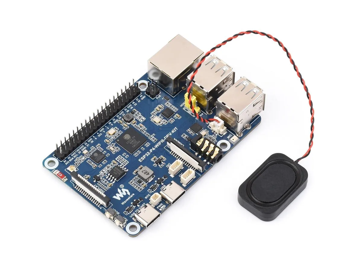 Green rectangular development board with pin headers and connectors