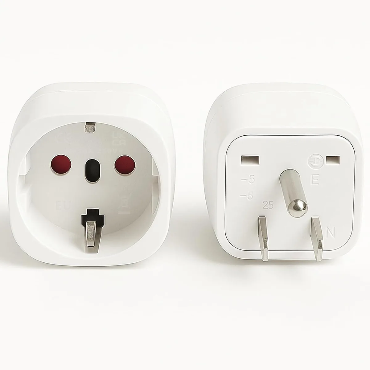 Two compact white EU to US plug adapters with straight blades