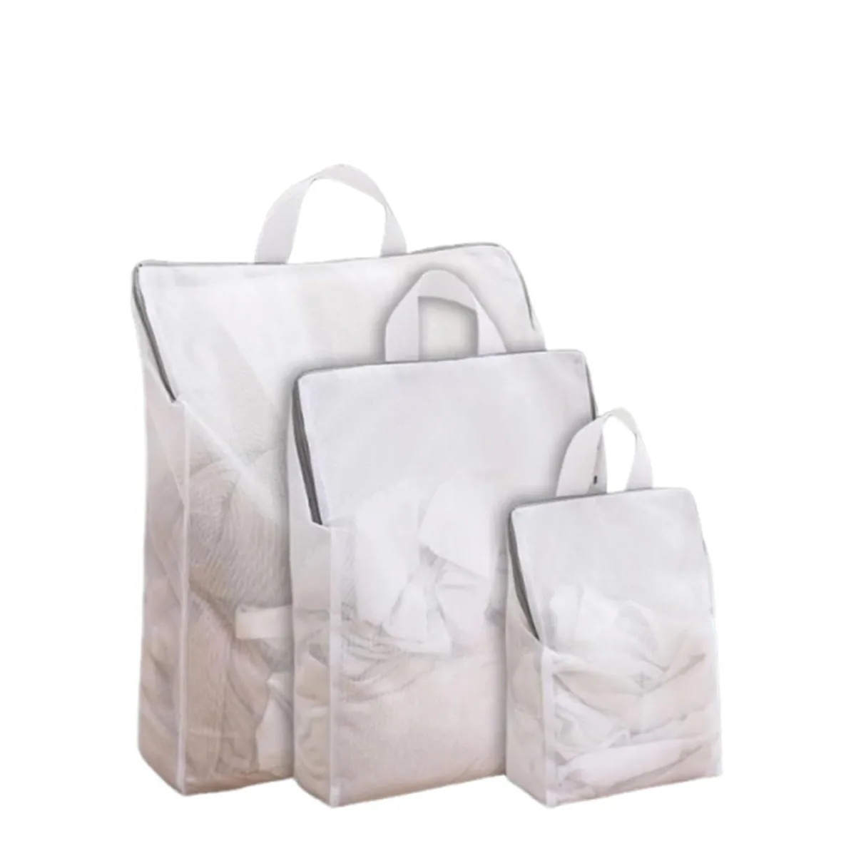 Three small grey mesh laundry bags with zippers