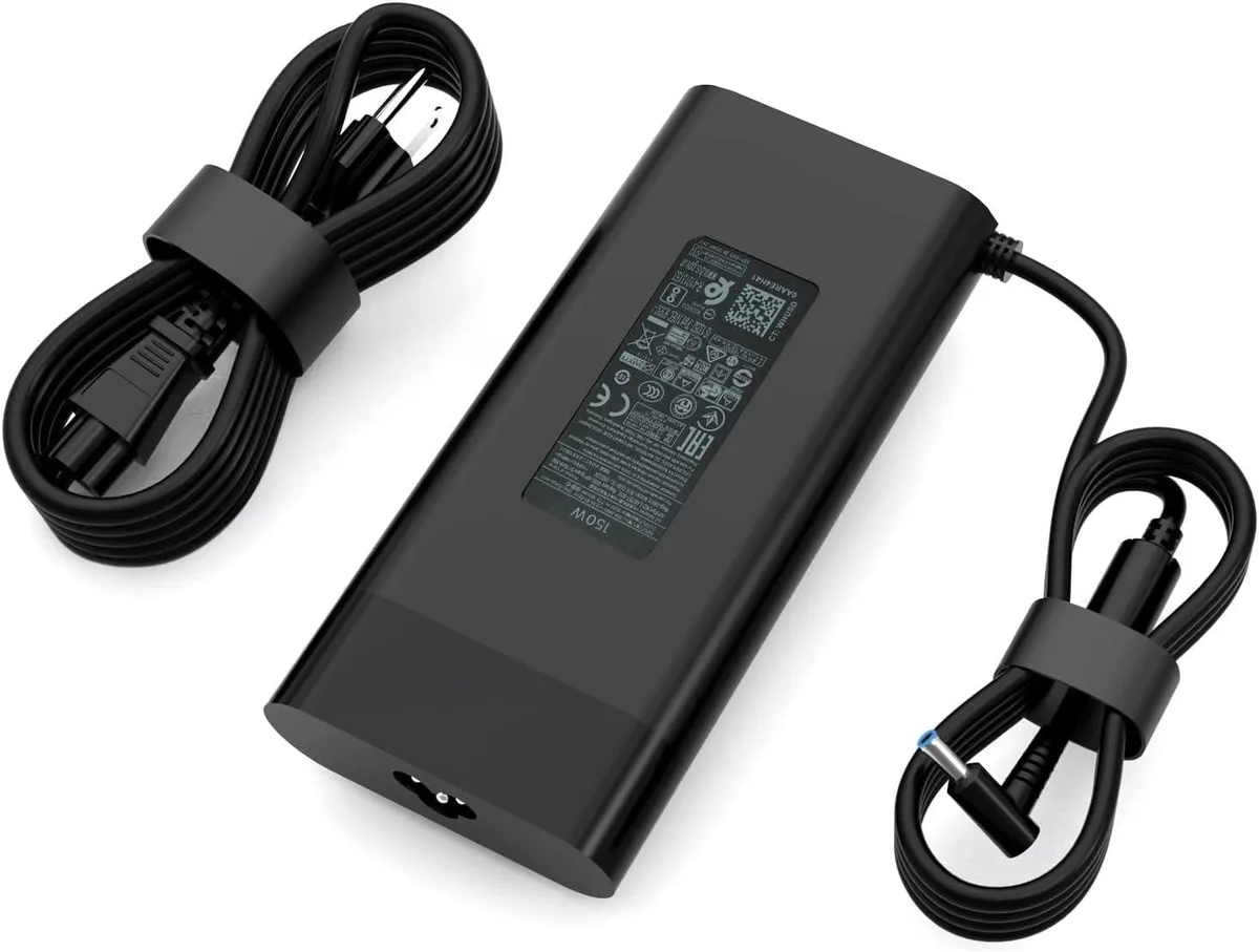 Rectangular black power brick with blue-tip barrel connector and detachable mains lead