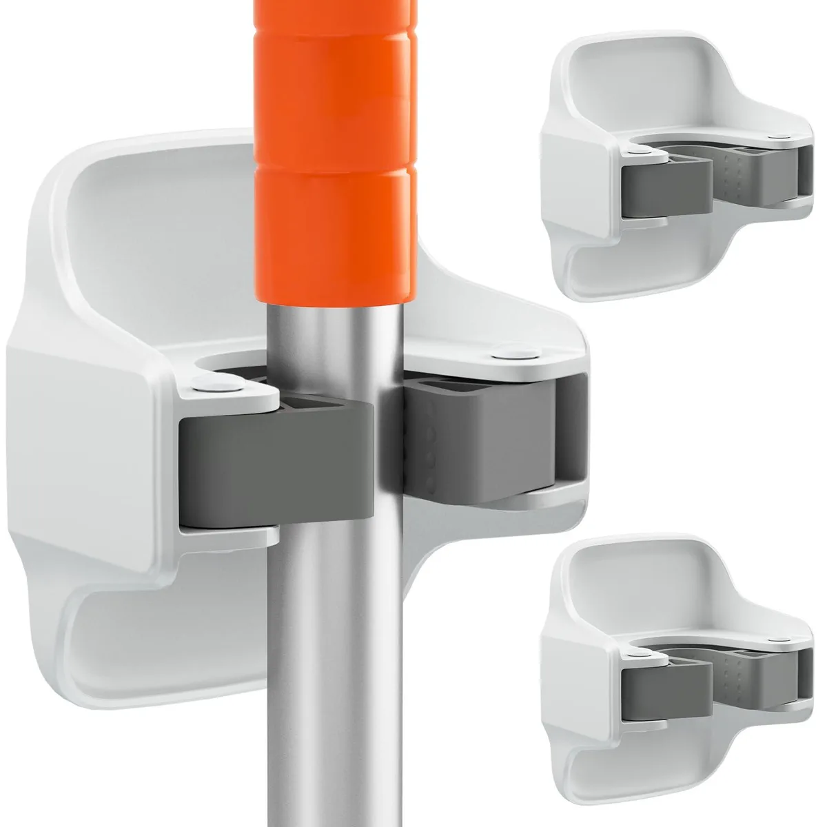 Three white plastic wall grippers with grey silicone centres, adhesive backs visible