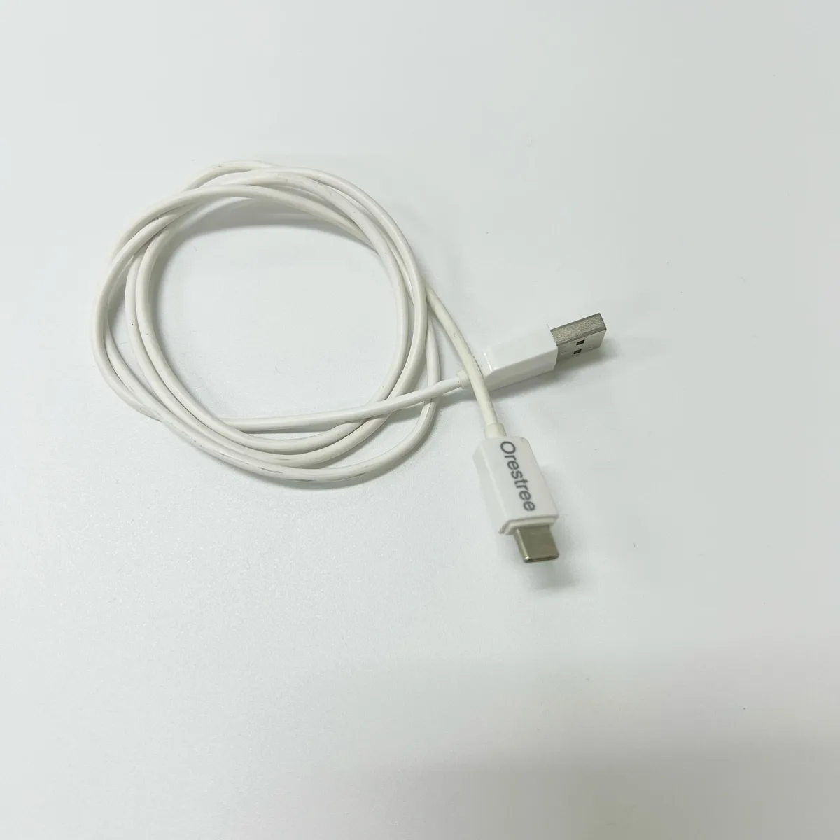 White USB-A to USB-C charging cable, reversible connector
