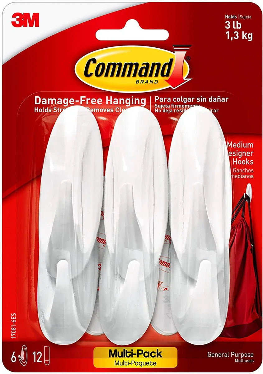 Six white medium designer hooks with twelve adhesive strips