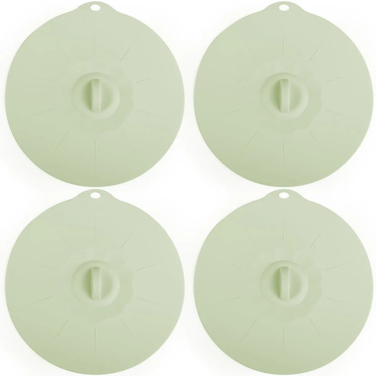 Four light green 7.8 inch silicone lids on a surface