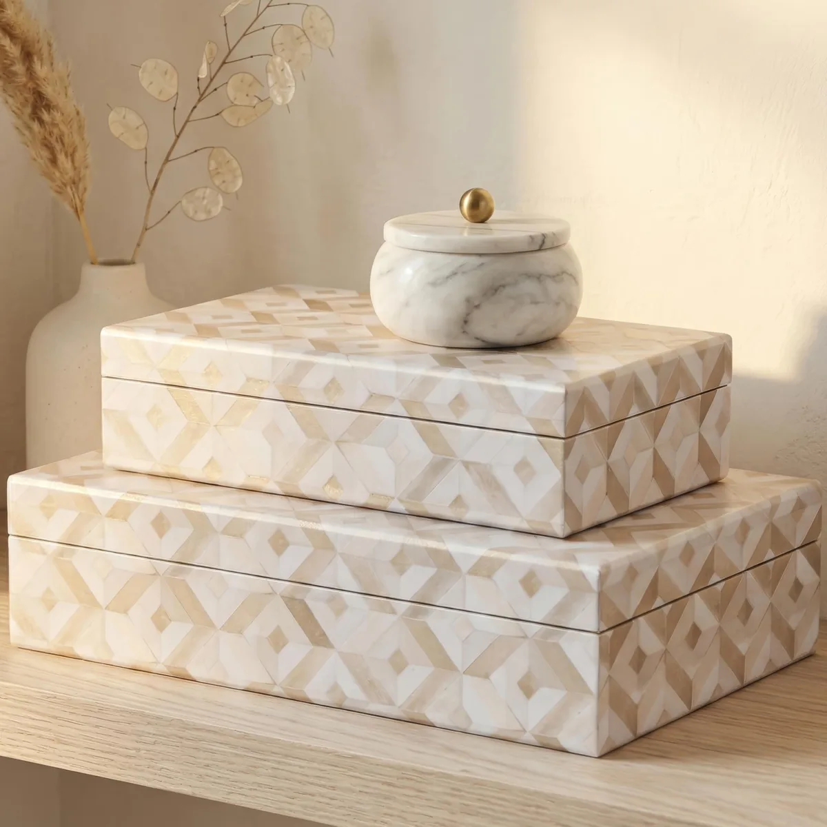 Two beige decorative storage boxes with lids, different sizes, pearlescent finish