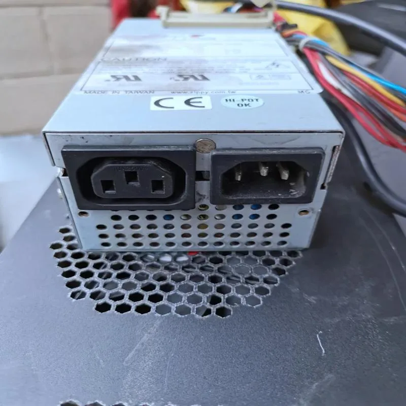 Compact black ATX power supply unit with cooling fan and cable bundle