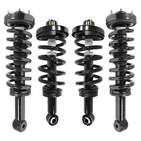 Four silver strut assemblies with black springs on grey background