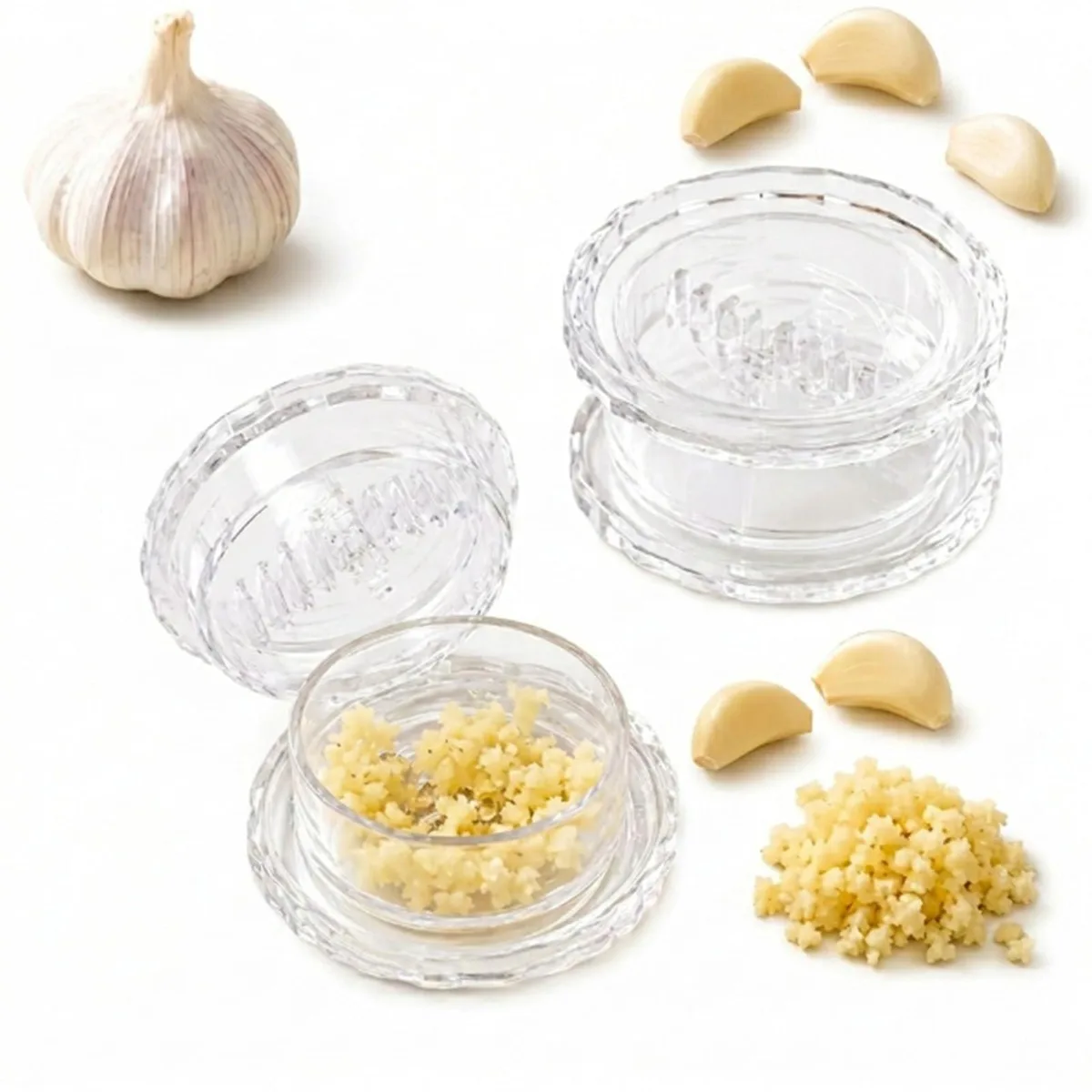 Two clear plastic garlic twisters, 81 mm wide, 41 mm high, smooth cylindrical shape with interlocking teeth inside