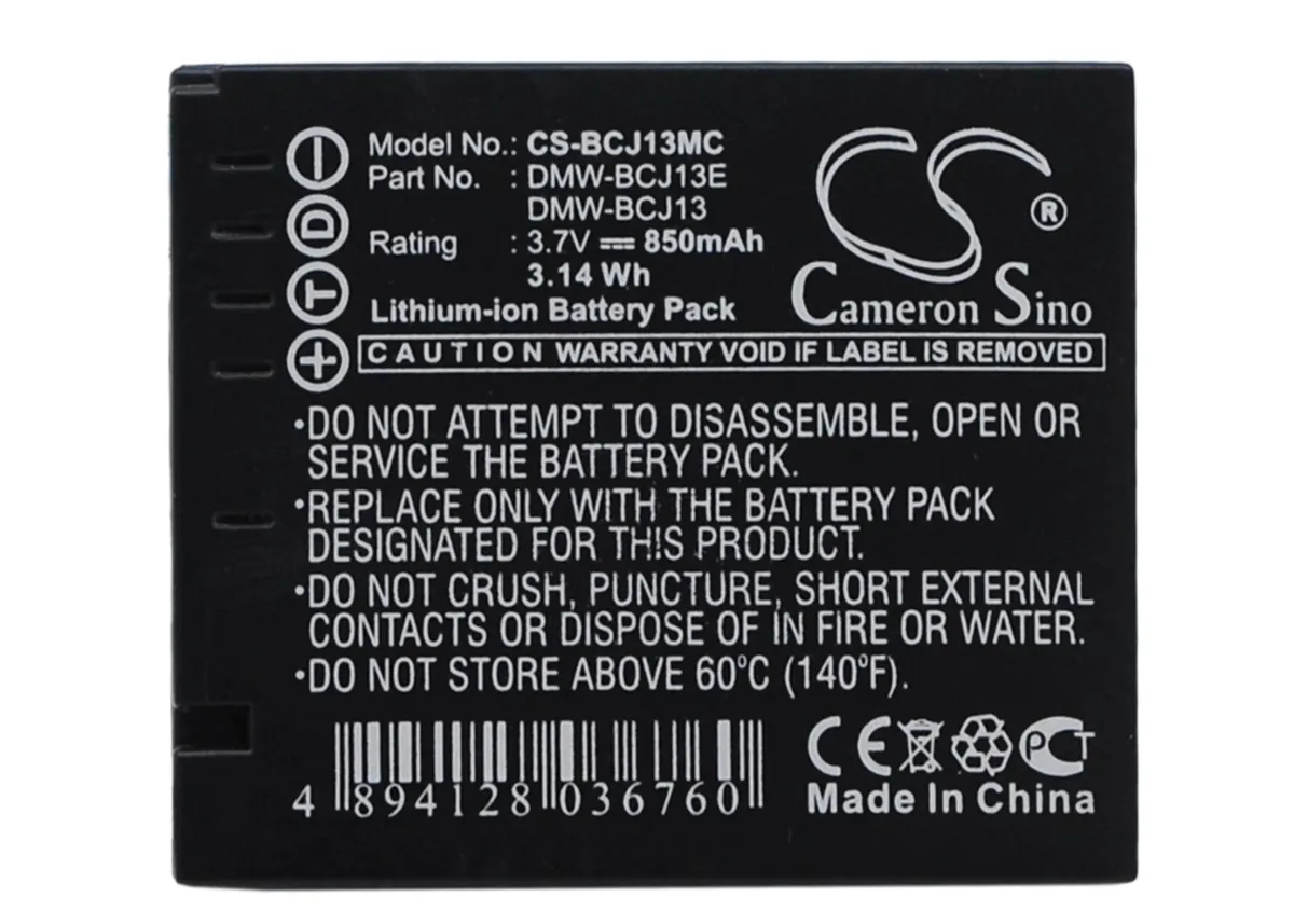 Small rectangular camera battery with dark plastic casing and gold contacts