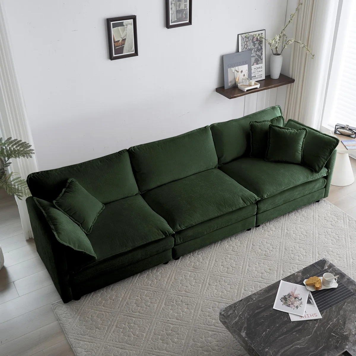 Green chenille three-seater sofa with two armrest pillows and three toss pillows