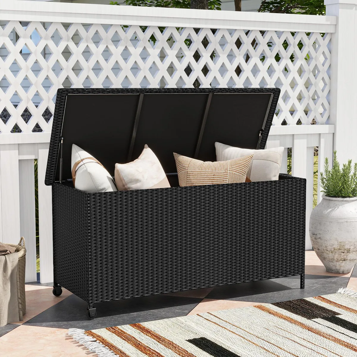 Black rectangular storage box with rattan texture and wheels
