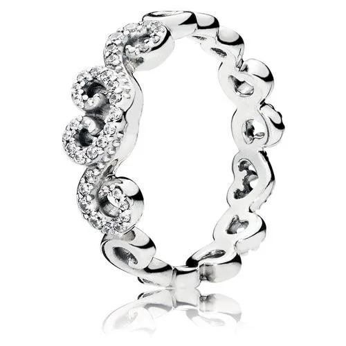 Sterling silver ring with swirling heart motif and eight clear cubic zirconia stones