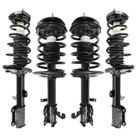 Four silver strut assemblies with black springs on cardboard