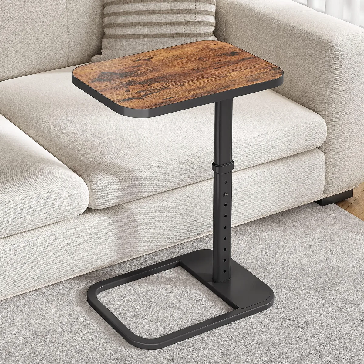 Brown C-shaped tray table with flip-top surface and metal frame, adjustable height settings