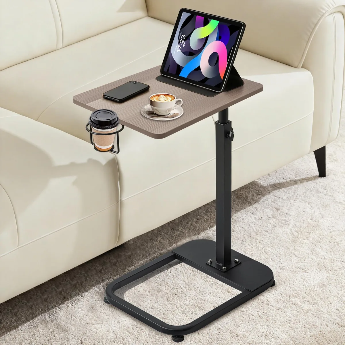Black C-shaped side table with rectangular top and metal frame