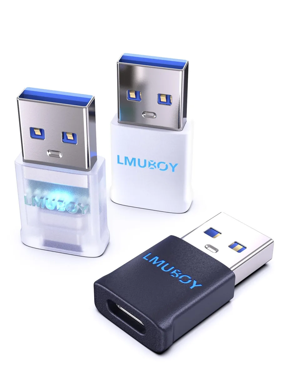 Three tiny USB-A to USB-C adapters in black, white and translucent plastic