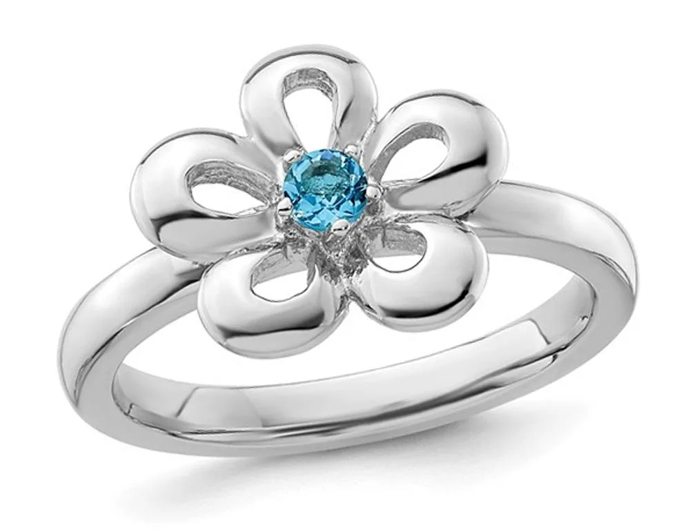 Sterling silver flower ring with central blue topaz, 3.80 grams
