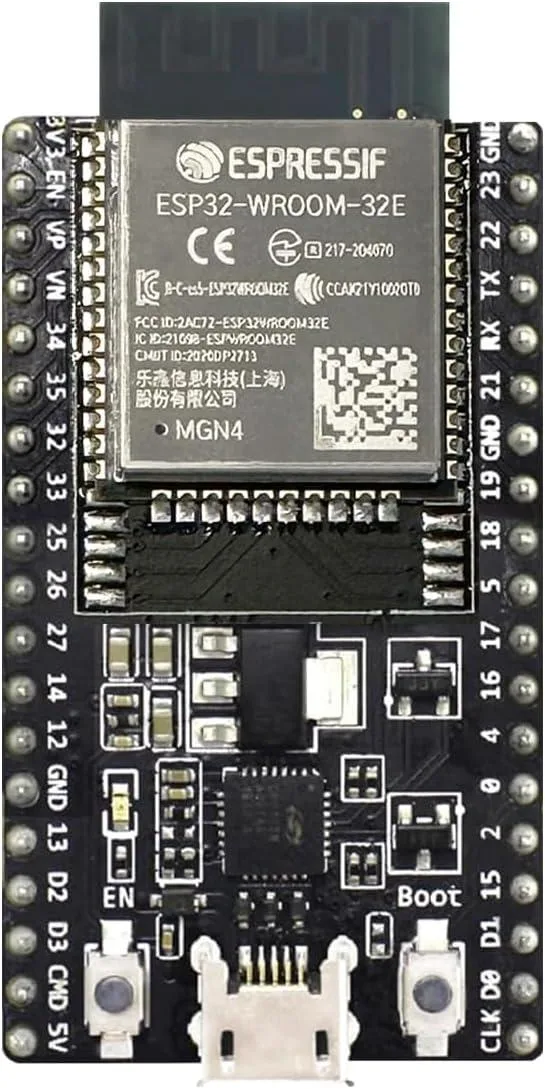 Green rectangular circuit board with ESP32 module and pin headers