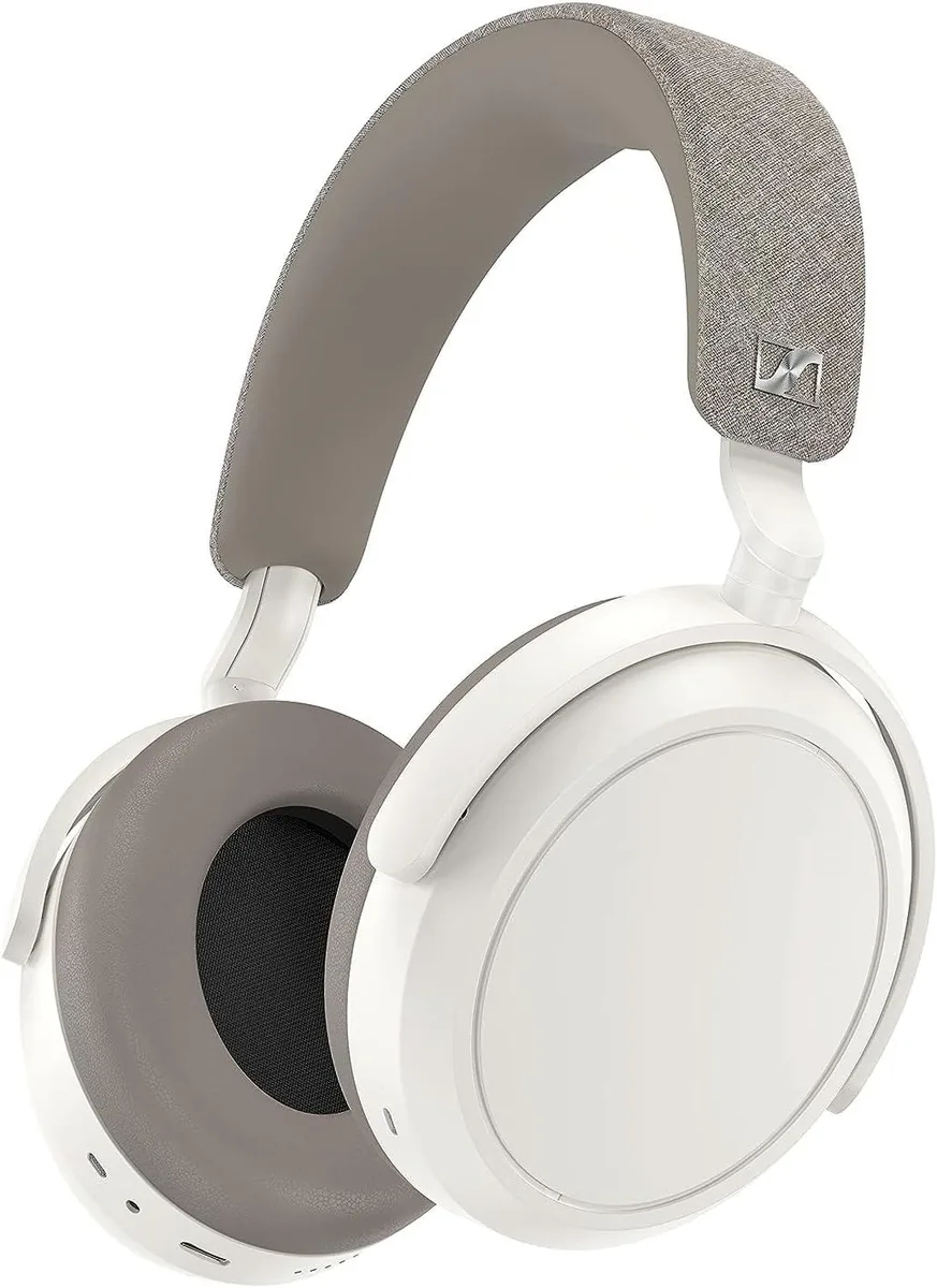 White over-ear headphones with padded headband and ear cups, foldable design