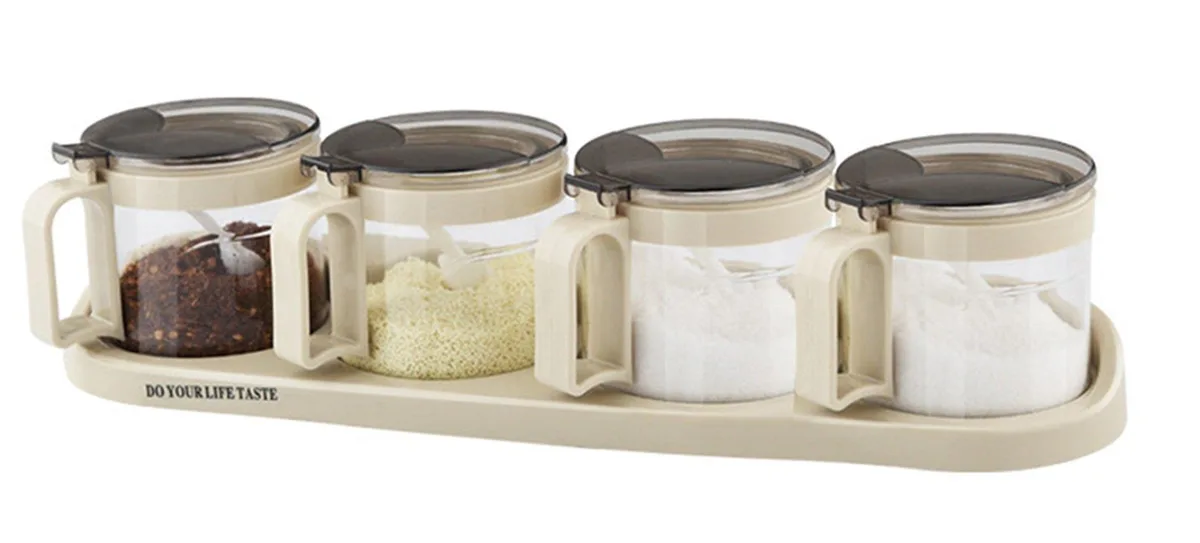 Beige glass spice-jar set on non-slip base with four spoons
