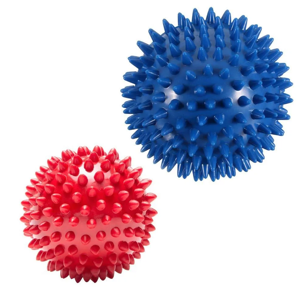 Two spiked PVC massage balls, blue 3.54in and red 2.95in, textured surface