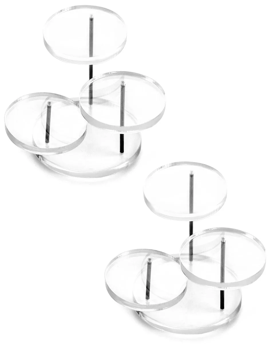 Two clear acrylic three-tier display stands with metal poles, round trays decreasing in size upward