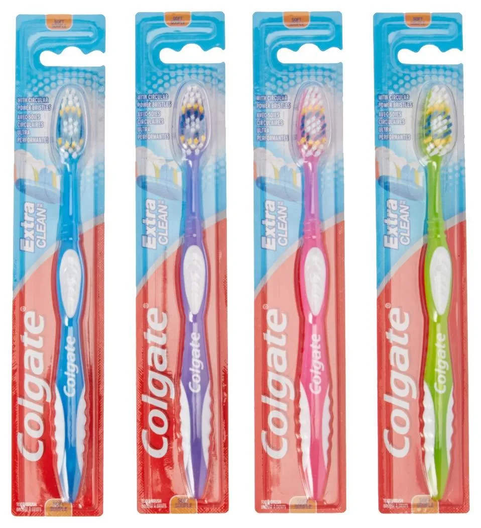 Twelve soft-bristled manual toothbrushes with oval heads, assorted colors, plastic handles, built-in tongue scrapers